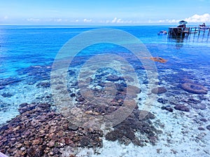 Landscape view of Derawan Island in Borneo with beautiful sky and sea.