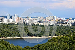 Landscape view of Dnipro river and its Left bank on the over side with new buildings in residential areas, Kyiv, Ukraine