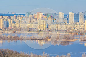 Landscape view of Dnipro river and its Left bank on the over side with new buildings in residential areas, Kyiv, Ukraine