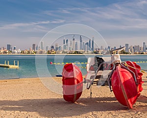 A landscape view of Dubai beach and sea in summer, famous building. UAE