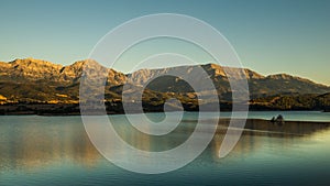 Landscape view of Erymanthos mountain range seen from Peiros lake and dam photo