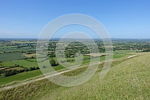 Landscape view of green farmland fields and clear blue sky photo