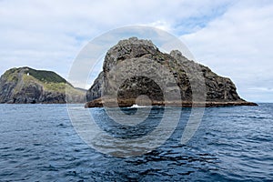 Landscape view with of a hole in the rock, Piercy Island, New Zealand