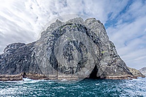 Landscape view with of a hole in the rock, Piercy Island, New Zealand