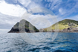 Landscape view with of a hole in the rock, Piercy Island, New Zealand