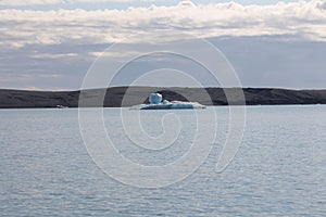 Landscape view of an iceberg surrounded by mountains