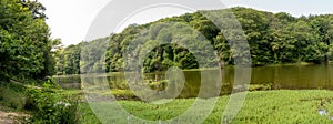 Landscape view of the lake in the Belgrad Forest, Istanbul with lush trees reflected on water