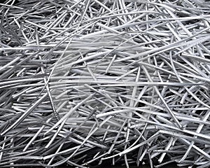 Landscape view of a large heap of pure aluminium wire recycled from power cables