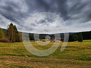 Meadow with Novohrad mountines on background photo