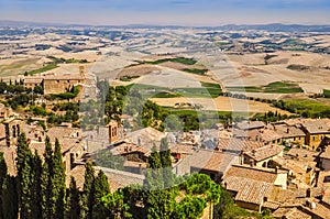 Landscape view of Montalcino town, fields and meadows photo