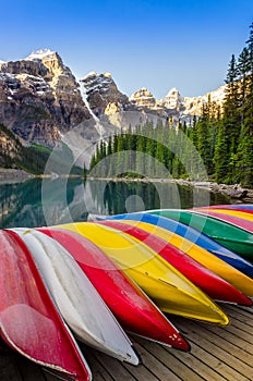 Landscape view of Moraine lake with colorful boats, Rocky Mountains