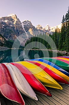 Landscape view of Moraine lake with colorful boats, Rocky Mountains