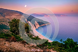 Landscape view of Myrtos beach at colorful sunrise, Kefalonia, Greece