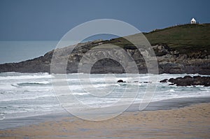 A Landscape View of North Fistral Headland including the Ocean and Sandy Beach Shore