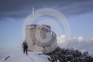 Landscape view on one alpinist on the top of mountain. Tower on