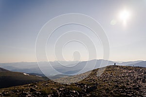 Landscape view of a person walking towards the top of Quandary Peak.