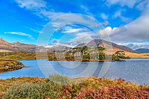 Landscape view At Pines Island and Twelve Bens, Derryclare Lough in County Galway Ireland