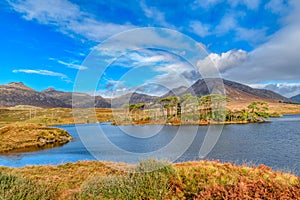 Landscape view At Pines Island and Twelve Bens, Derryclare Lough in County Galway Ireland