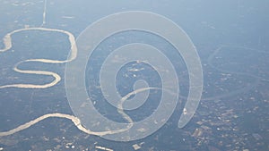 landscape view of the river in bangkok from drone airplane fly over in summer sunshine day with smog smoking PM2.5 pollution