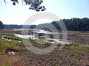 Landscape view of river get dry near waterfall and blue sky