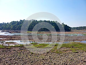 Landscape view of river get dry near waterfall and blue sky