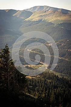 Landscape view of a roade winding through mountains in the morning near Quandary Peak.