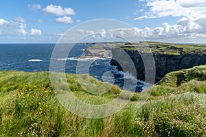 Landscape view of the rugged coast and cliffs at the Cliffs of Kilkee in County Clare