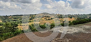 A landscape view of rural village of India and clouds