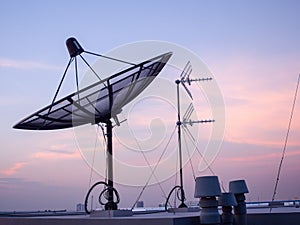 Landscape view of satellite dish on top of the building.