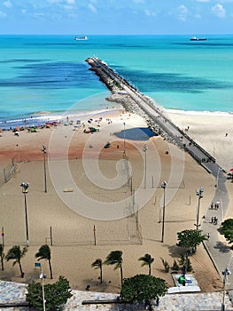Landscape View of the sea and people in the sand and buildings at Praia de Iracema Beach, Fortaleza, CearÃÂ¡ Brazil photo