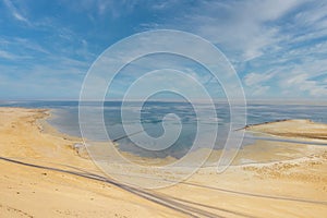 Landscape view of Sealine Sand dunes and lake in Doha Qatar