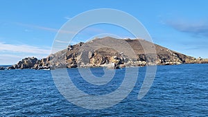 Landscape view of The Sept-iles mountain by the sea under blue sky