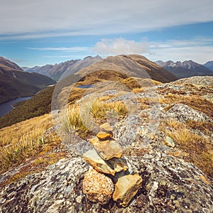 Landscape view of small rocks pyramid and mountain range, NZ