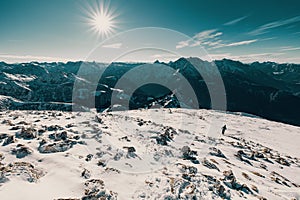 Landscape view of snowy Hohes Brett, the Berchtesgaden Alps with sky and sun shining background