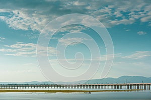 Landscape View of Train crossing Pasak Chonlasit Dam. Reservoir for agriculture at Lopburi,Thailand