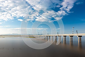 Landscape View of  Train crossing Pasak Chonlasit Dam. Reservoir for agriculture at Lopburi,Thailand