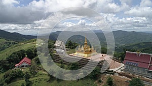 Landscape view of Wat Koh Pha Doh Koh Pha Doh temple with Maha Chedi, the golden pagoda on the top of the mountain, Chiang Mai, Th