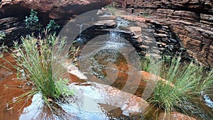 Landscape view of waterfalls at Hancock Gorge Karijini National Park Western Australia