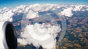 Landscape view window of flying airliner