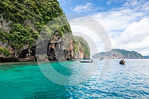 Landscape of Viking cave with longtail boat for traveler, Maya bay, Phi Phi island, Andaman sea, Krabi, near Phuket, Travel