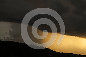Sunset with orange grey storm clouds. photo