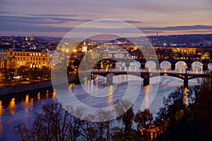 landscape with Vltava river and Karlov most at night in autumn in Prague