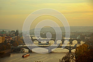 landscape with Vltava river and Karlov most at sunset in autumn in Prague