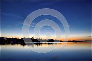 The landscape of water reflection at twilight.  Gravenhurst, Ontario, Canada