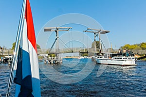 Landscape with waterways and canals of North Holland with boats, canal-side lifestyle in the Netherlands