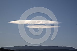 Landscape with white clouds similar to UFO