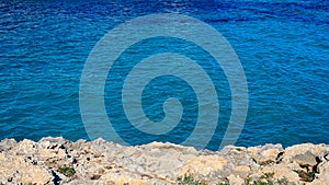 landscape: white rock and blue sea