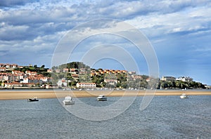 Landscape and white yacht in San Vicente de la Barquera city Spain