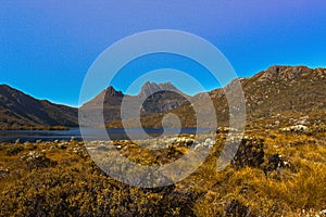 The landscape of wild vegetation, Dove Lake and Cradle Mountain in Cradle Mountain - Lake Saint Clair National Park, Tasmania.