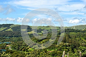 Landscape of a wind farm on top of the hills